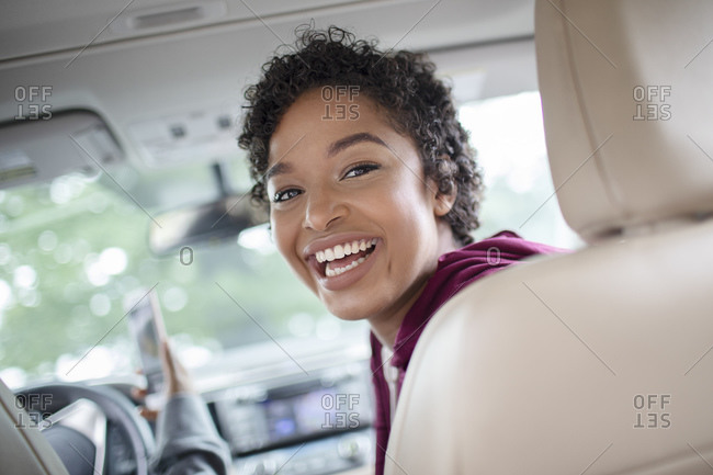 Cheerful Woman Sitting On Front Seat In Car