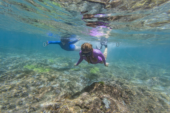 Two young women snorkeling in Nusa Penida island- Bali- Indonesia