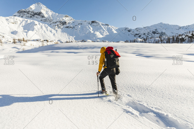 Hiking with snowshoes in the mountains- Valmalenco- Sondrio- Italy