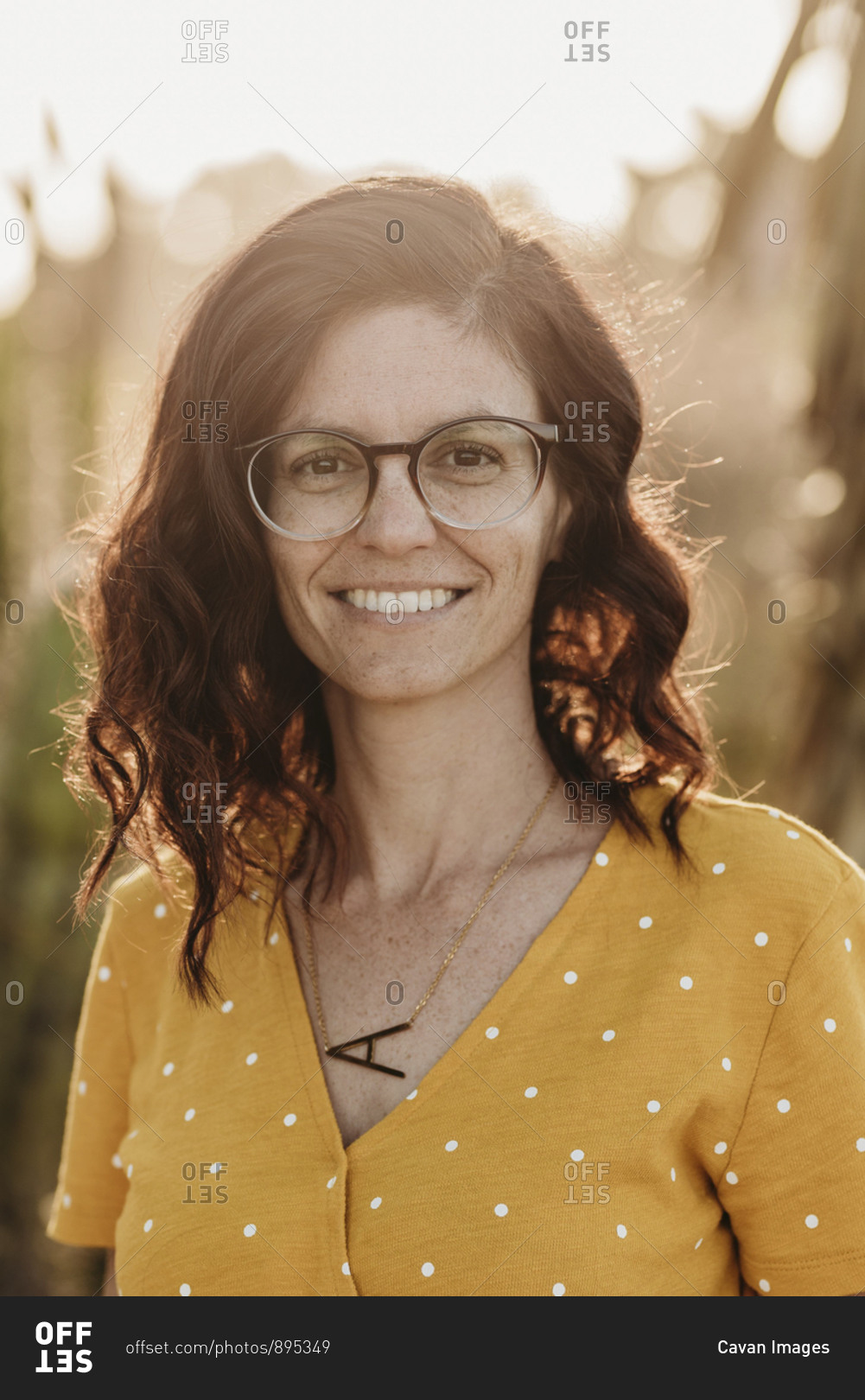 Headshot Portrait Of Mid Adult Female Mother With Glasses Outside