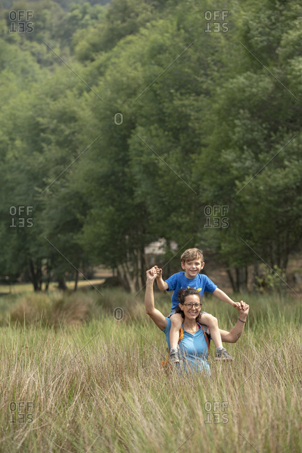 Mom and son on a tall grass filed in Huasca de Ocampo, Mexico