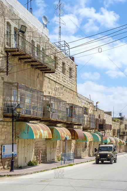 Palestine, West Bank, Hebron - April 5, 2019: Empty shops and buildings on Shuhada Street, Hebron, West Bank, Palestine