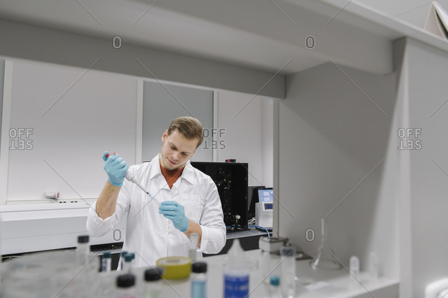 Scientist working with a pipette in laboratory