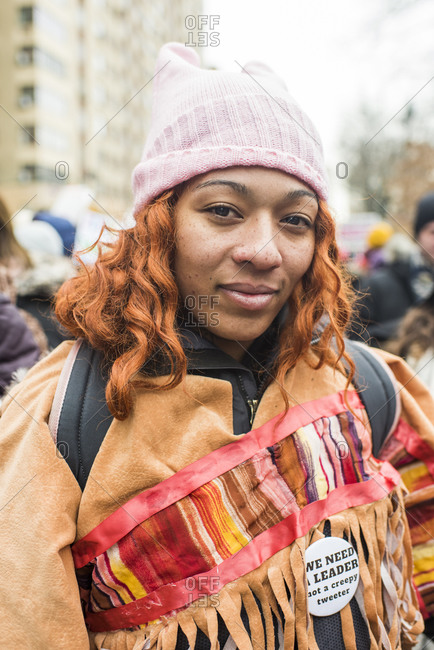 Manhattan, New York, USA - January 18, 2020: Portrait of an African American woman wearing a pussycat hat at the Women's March, New York City