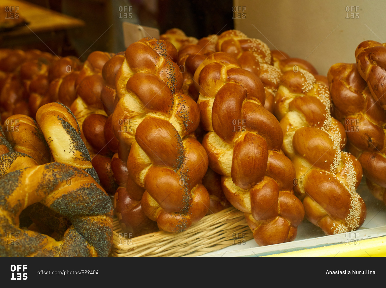 Challah and buns at the display of traditional jewish bakery at Marais quartier in Paris