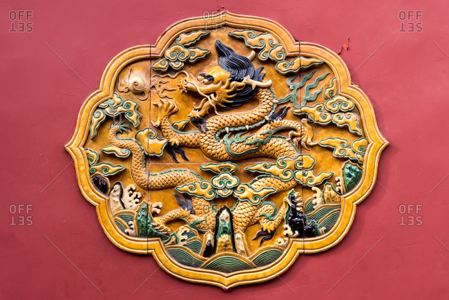 Decorative terracotta tiles with yellow dragon motif