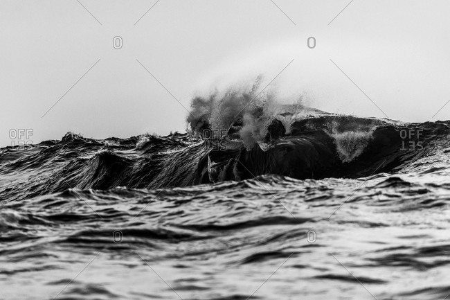 Detail of splashing waves in black and white