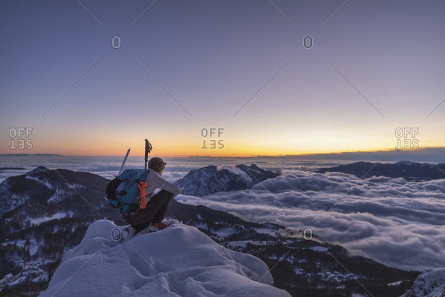 Mountaineer on the mountain summit during twilight- Orobie Alps- Lecco- Italy