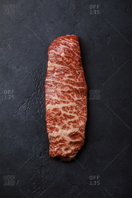 Raw fresh marbled meat Steak Wagyu beef on dark background