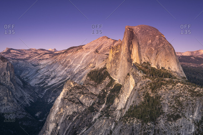 Scenic view of Half Dome granite rock formation at Yosemite National Park after sunset, Sierra Nevada, Central California, California, USA