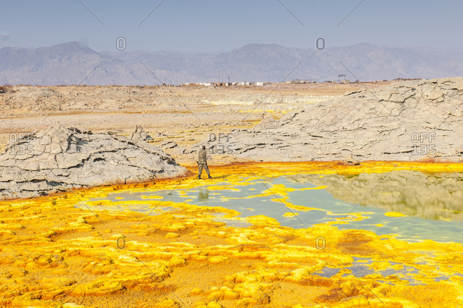 Ethiopia, Tigray - December 4, 2010: Soldier walking at the geothermal springs of Dallol