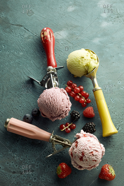 Assorted ice cream on scoop and fresh fruits
