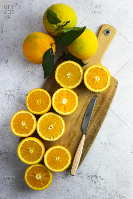 Freshly cut oranges on cutting board