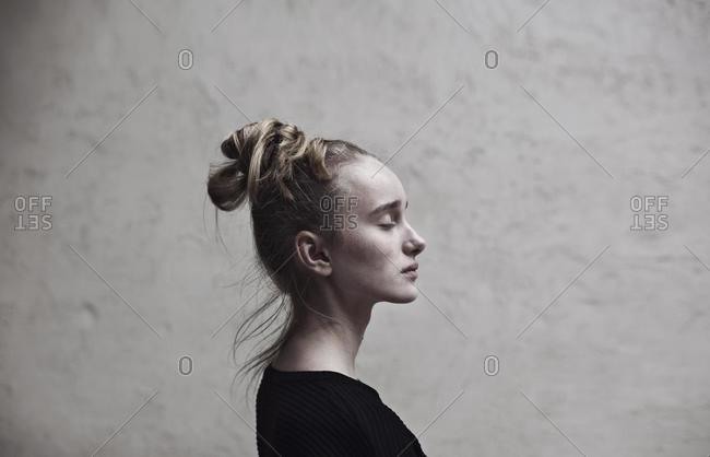 Portrait of a teenage girl with her eyes closed