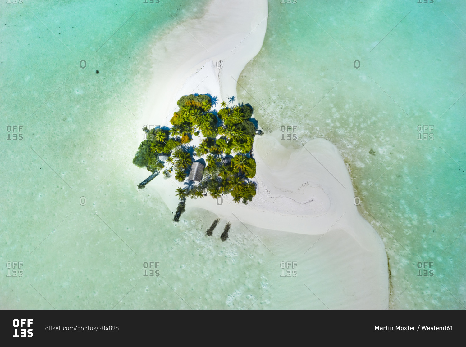Maldives- Aerial view of secluded hut on small sandy island in South Male Atoll