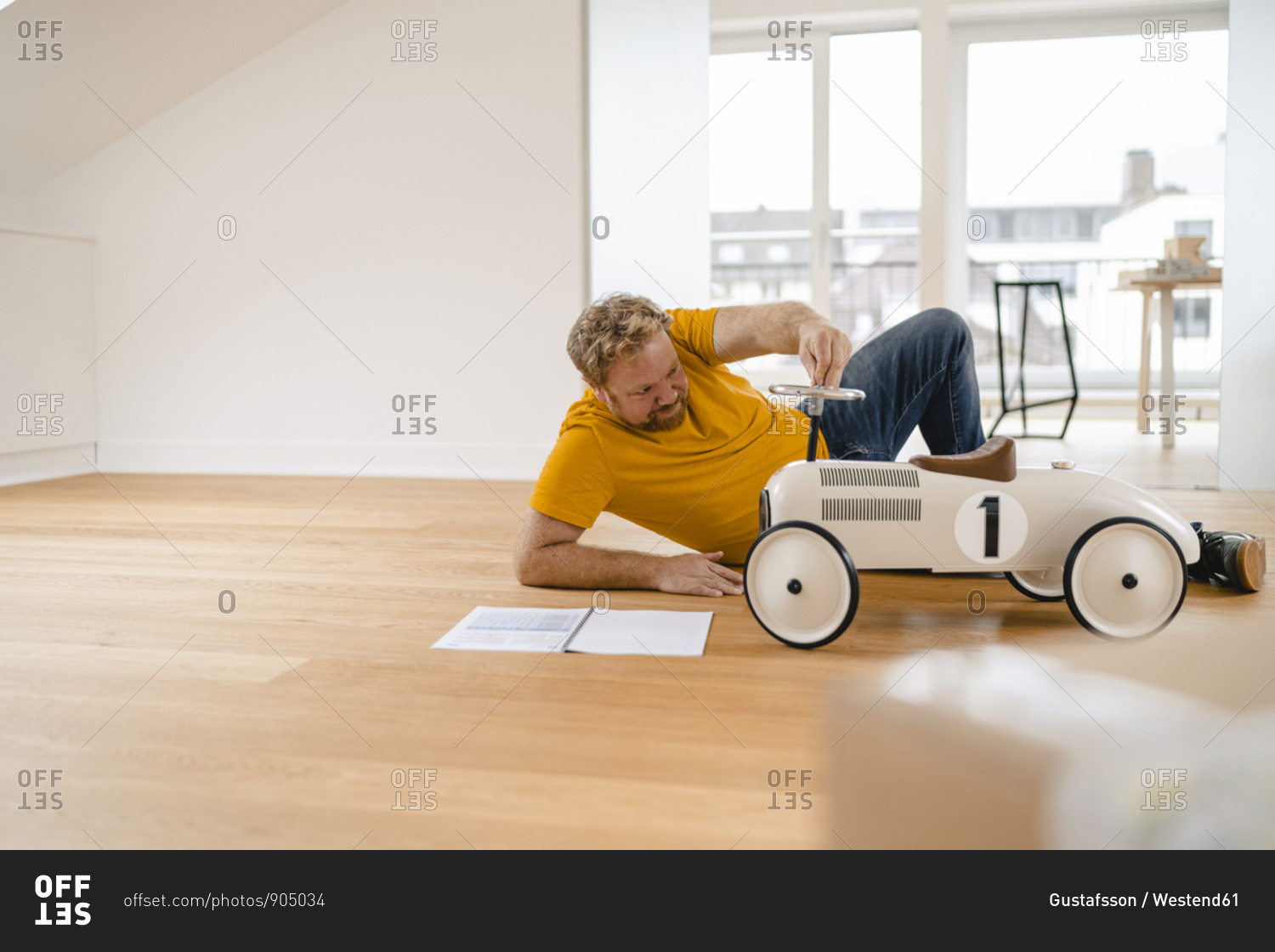 Man playing with toy car