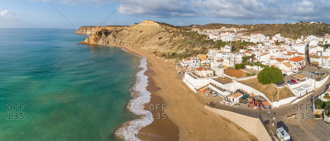 Panoramic aerial view of Praia do Burgau on a sunny day, Budens, Portugal