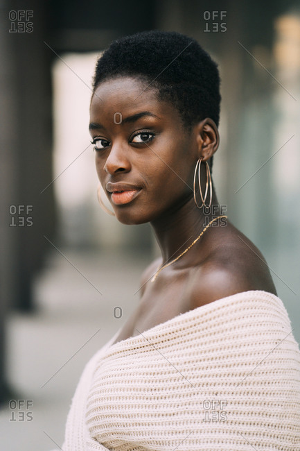 Portrait of young woman wearing earrings