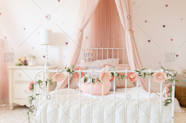 Toddler Girl room with felt flowers and canopy