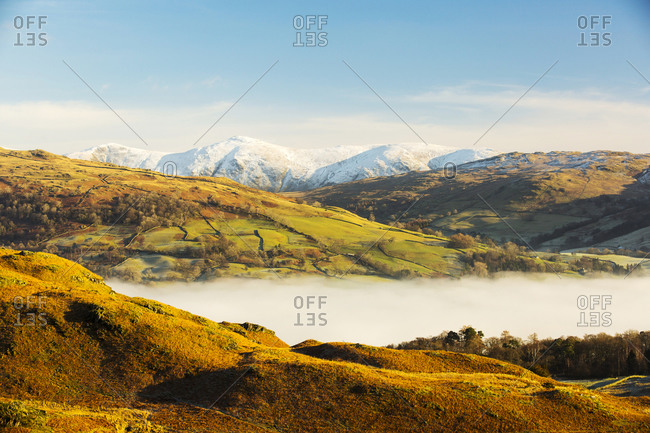 Looking towards the Kentmere fells from Loughrigg above valley mist from a temperature inversion, Lake District, UK.