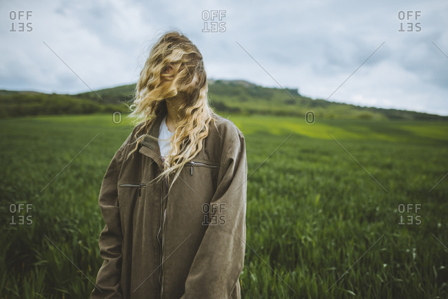 Windswept woman in field in Crimea, Ukraine