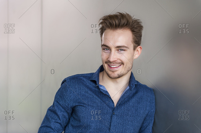 Portrait of smiling young businessman with stubble