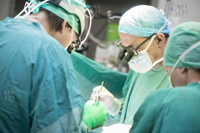 Heart surgeons during a heart operation