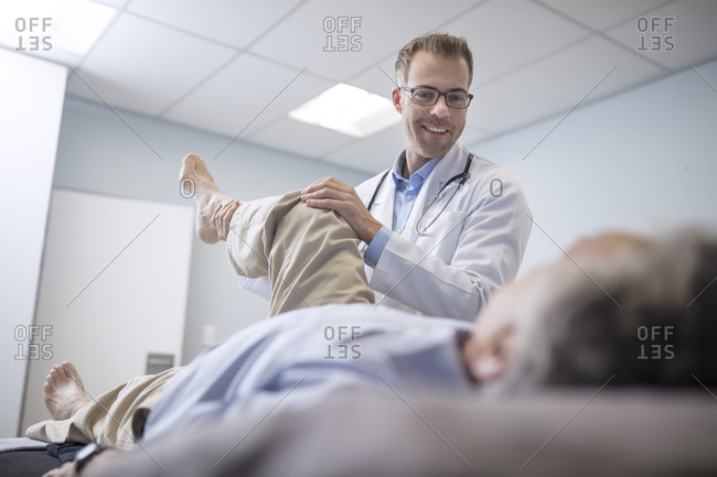 Doctor examining senior patient in medical practice