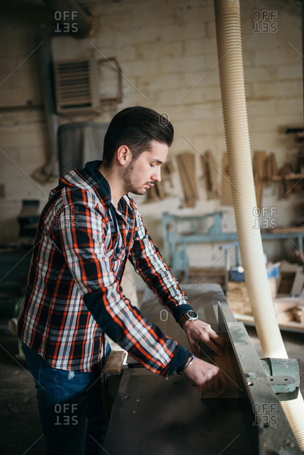 Carpenter working in a his private workshop