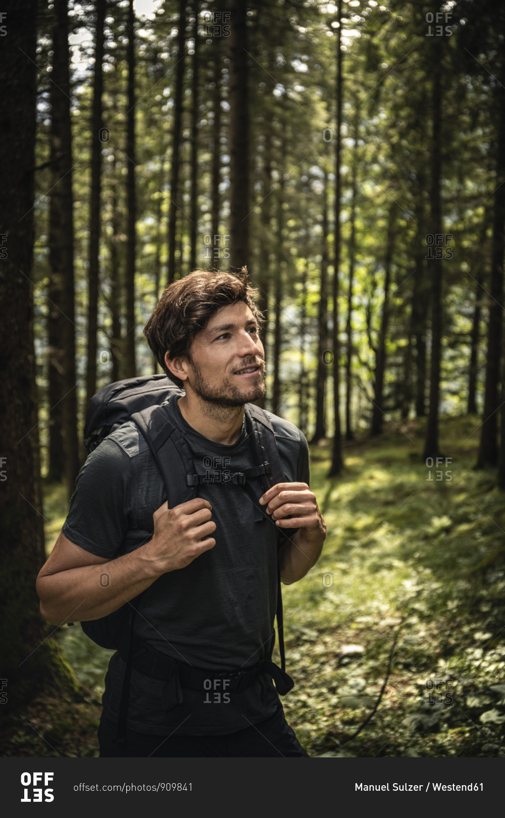 Man with backpack on a hiking trip in forest- Karwendel- Tyrol- Austria
