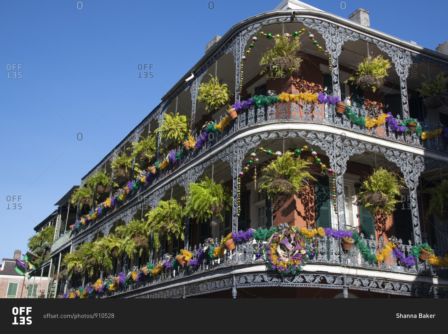 A building adorned with Mardis Gras decorations in New Orleans stock