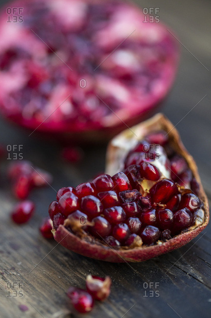 Overview of beautiful red Pomegranate, over a wooden table