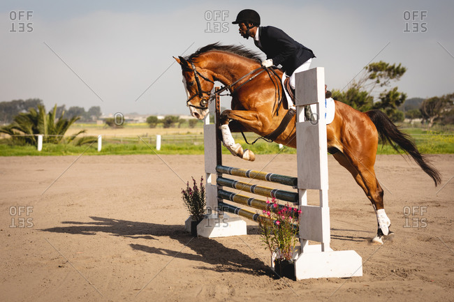 Man jumping with his dressage horse on a show jumping event