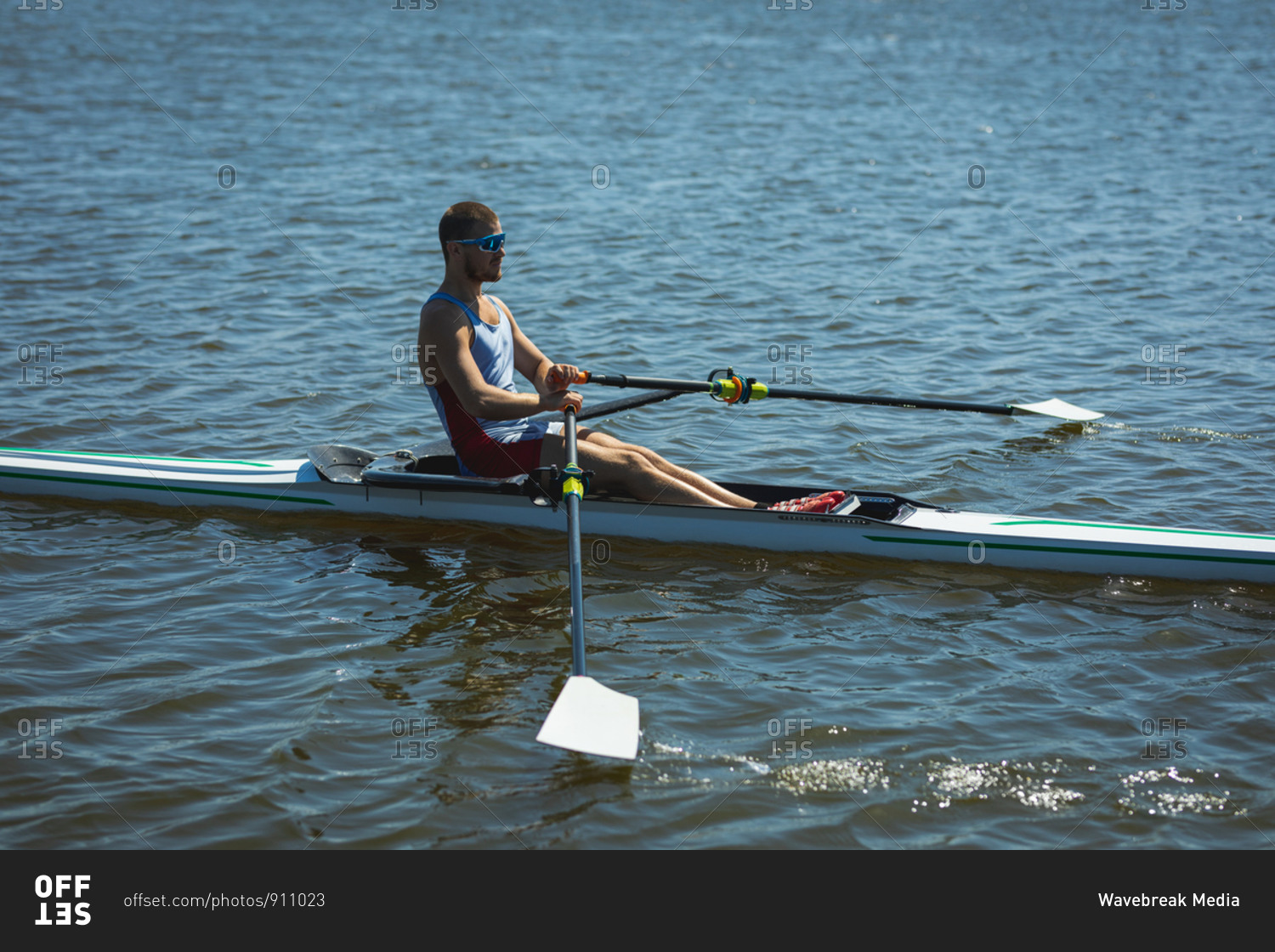 Caucasian man training a rowing boat