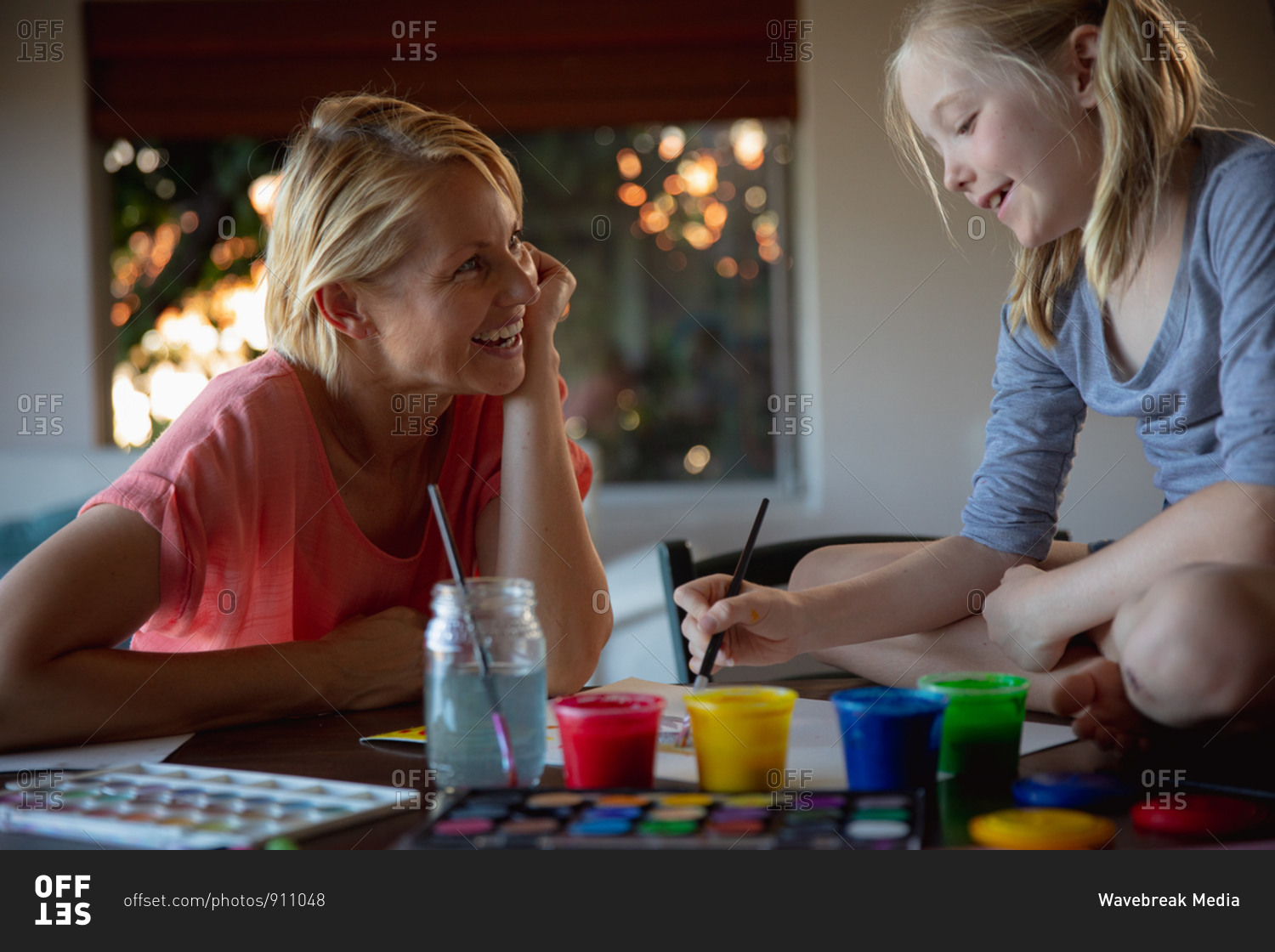 Mother and daughter painting together