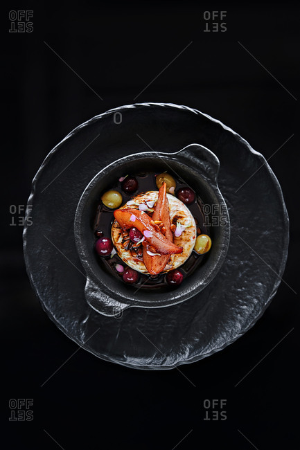 Overhead view of a gourmet dessert dish in a black dish