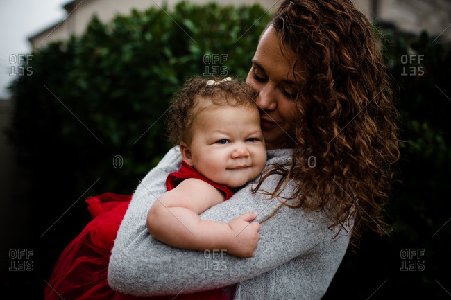 Late Thirties Mother Holding Biracial Baby