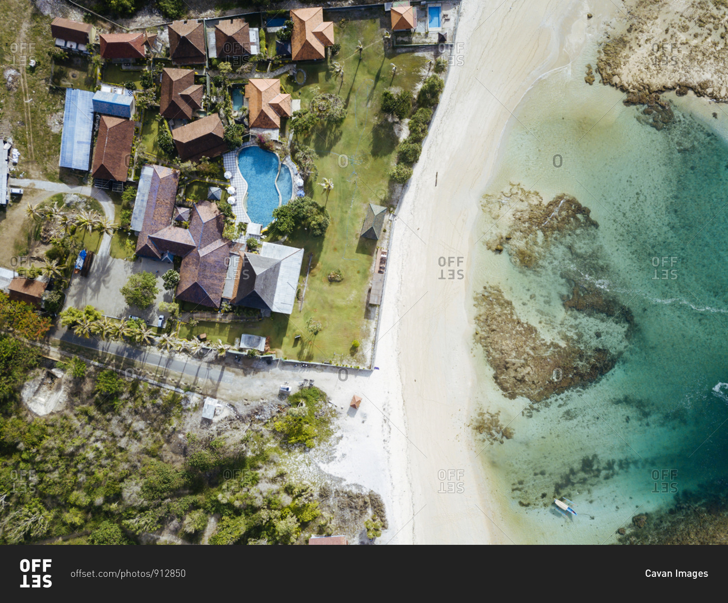 Aerial view of tropical resort at ocean coastline