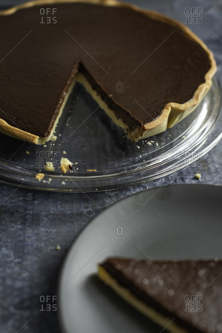 Serving a slice of a chocolate tart