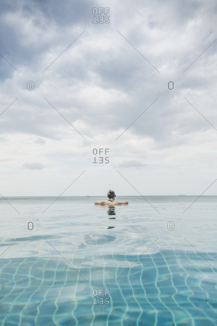 Rear view of woman in infinity pool- Koh Lanta- Thailand
