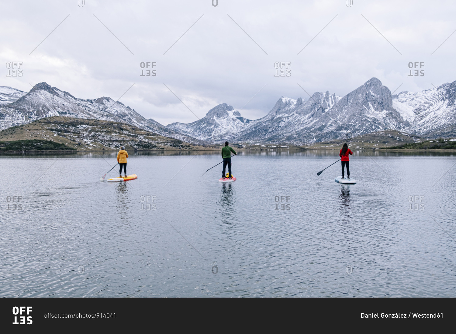 Three people stand up paddle surfing- Leon- Spain