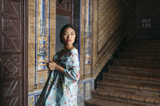 Portrait of beautiful young woman wearing a kimono in a palace