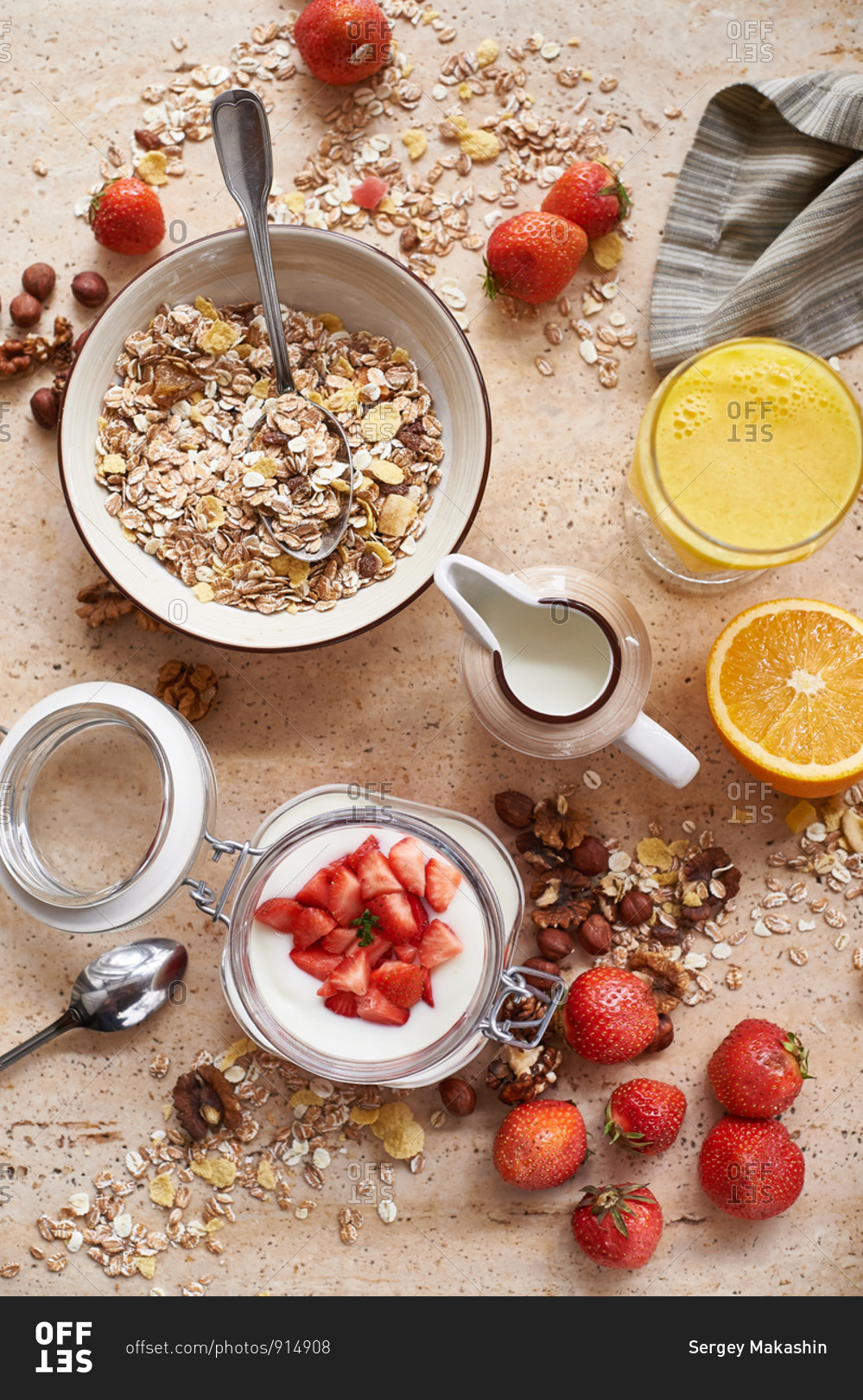 Oatmeal granola muesli with yogurt with strawberries and orange juice