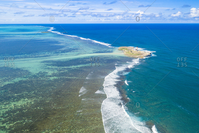Aerial view by drone of historical island of Ile au Phare (Ile Aux Fouquets) in between coral reef and Indian Ocean, Mahebourg, Mauritius, Indian Ocean, Africa
