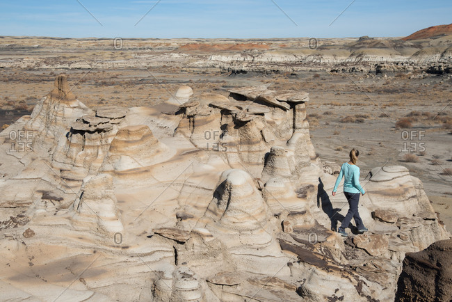 Hiking around hoodoo sandstone formations in Bisti/De-Na-Zin Wilderness, New Mexico, United States of America, North America