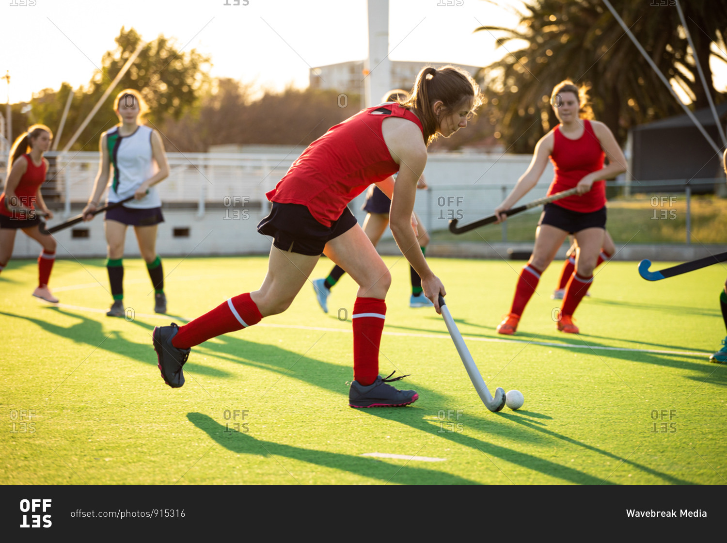 Side view of a Caucasian female field hockey player, during a field