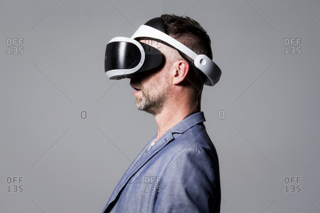 Profile view of a man wearing a virtual reality headset