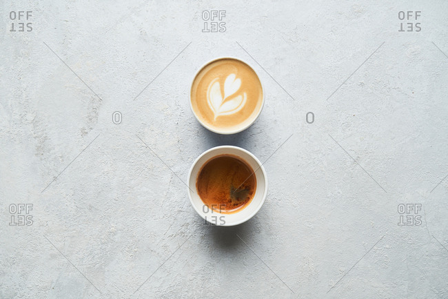 Overhead view of a latte and a shot of espresso