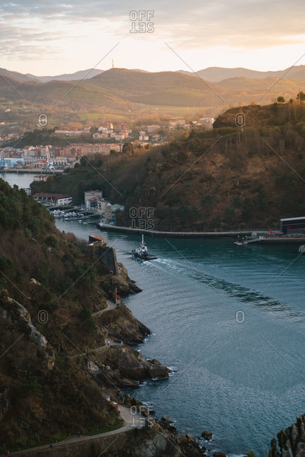 January 31, 2020: Boat entering Bay of Pasajes in the Basque Country during sunset