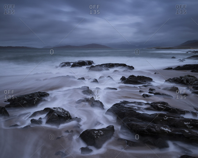 Flowing waves across small rocky beach, near Scarista, Isle of Harris, Scotland